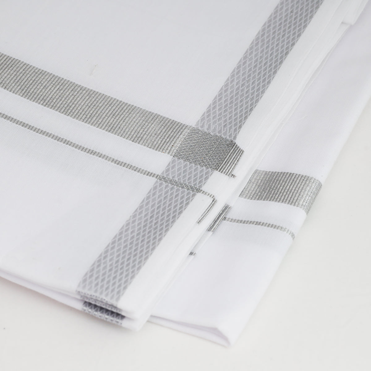Men's white dhoti with silver jari border Karikalan